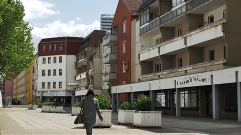 Static view of old east German empty shopping street with few people Stock Footage 200891939