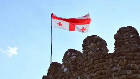 Static view of old georgian flag waving in slow motion with historical Sams.. Stock Footage 232389051