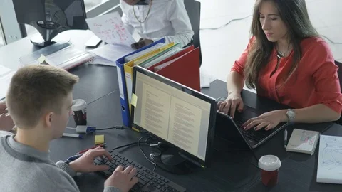 Static view of people working efficiently in a contemporary workplace Stock Footage 73850130