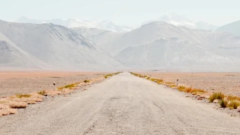 Static view popular the M41 road or Pamir Highway road with Pamir Mountains.. Stock Footage 281581974