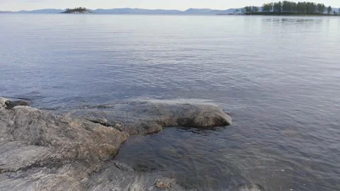 Static view to sea shore, pine forest and island. Kandalaksha gulf, White Sea. 動画素材 147507941