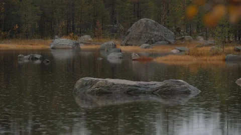 Static view to small Karelia lake. Drizzling rain. Autumn forest Video stock 147743843