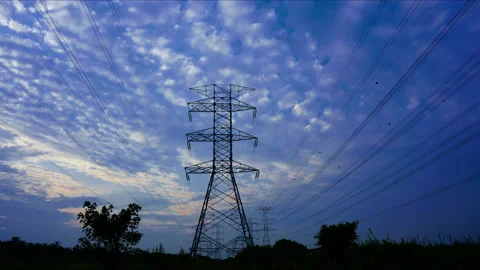 Static view of sunrise timelapse rolling clouds over pylon power lines. Stock Footage 137925909