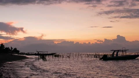 Static view on sunset and boats on the beach Stock Footage 165843701