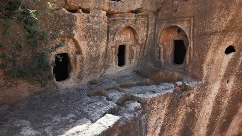 Static View of Three-Window Cave Room with Drone Pullback After 3 Seconds Stock Footage 334794961
