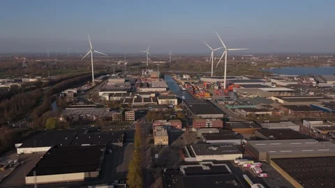 Static wide aerial view of wind turbines and container terminal Video stock 335658662