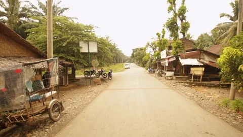 Static wide angle shot of shops and houses in rural Indonesia Asia Stock Footage 107654596