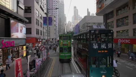 Static, wide angle view, of ding ding trams in Hong Kong, China Stock Footage 322784098