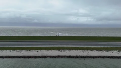 Static wide composition of dam between lake and sea Stock Footage 331838399