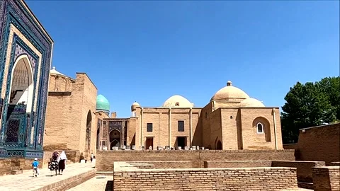 Static wide shot of ancient Islamic mausoleums at Shah-i-Zinda, Samarkand Stock Footage 336738098