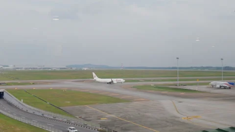 Static Wide Shot of Batik Air Aircraft at KLIA Runway Stock Footage 343905254