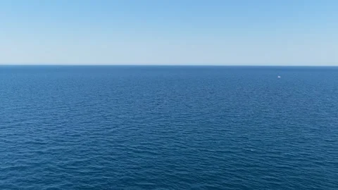 A static wide shot of the calm blue Mediterranean Sea under a clear sky Stock Footage 346718244