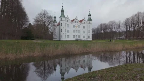 A static wide shot captures the elegant white architecture of Ahrensburg Palace 스톡 동영상 334677298