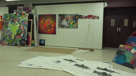 A static wide shot of a creative studio space filled with colorful urban Видео 335964379