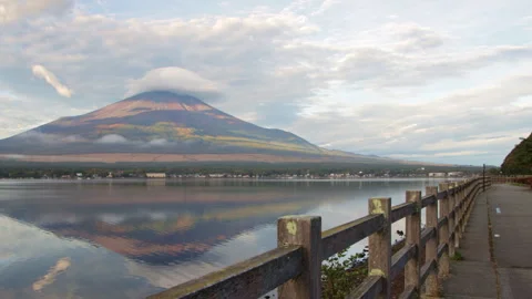 Static wide shot of Mount Fuji with cloud cap and reflection on Lake Yamanaka Stock Footage 321123750