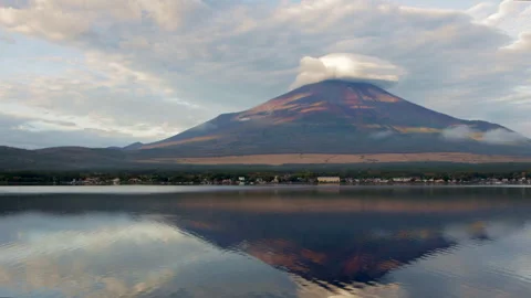 Static wide shot of Mount Fuji with cloud cap and reflection on Lake Yamanaka Stock Footage 321123897