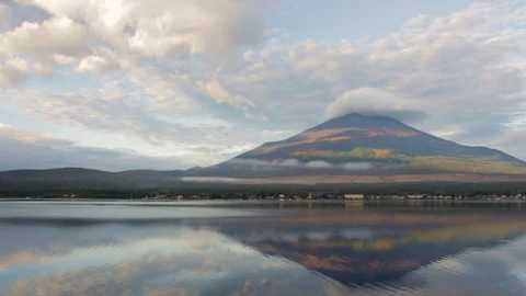 Static wide shot of Mount Fuji with cloud cap and reflection on Lake Yamanaka Stock Footage 321124753