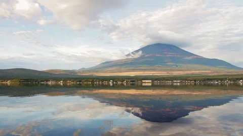 Static wide shot of Mount Fuji with lenticular cloud reflected in Lake Yamanaka Stock Footage 321126252