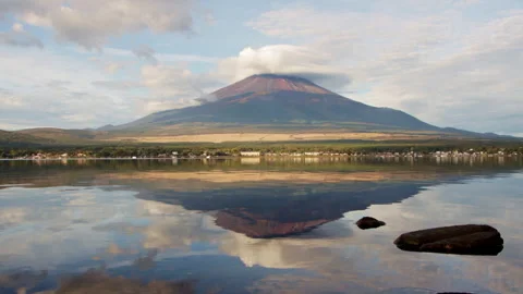 Static wide shot of Mount Fuji reflected in Lake Yamanaka with lenticular clouds Stock Footage 321127449