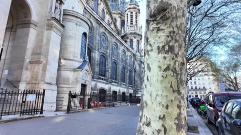 Static wide shot of the Saint-Augustin Church upper facade and rose window under Vídeos de archivo 332656663