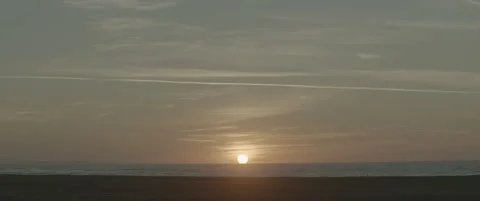 Static Wide Shot of Suffolk Coastline at Sunrise with Shingle Beach Foreground Stock-Footage 320177451