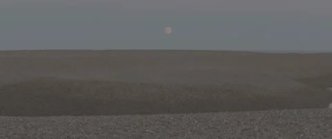 Static Wide Shot of Suffolk Shingle Beach at Dusk with Full Moon Stock-Footage 320114737