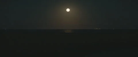 Static Wide Shot of Suffolk Shingle Beach at Night with Moonlight and Distant Sh Stock-Footage 320114771