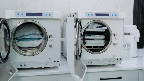 Static wide shot of two autoclave steam machines for sterilization medical tools Stock Footage 131683582