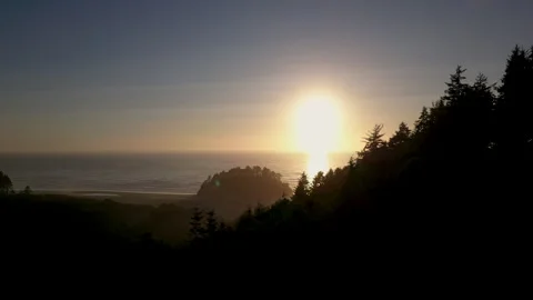 Static wide silhouette shot of Proposal rock at Neskowin beach at Sunset Stock Footage 249028190