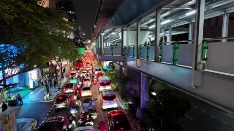 Static wide time lapse of heavy evening traffic on Sukhumvit Road Stock Footage 297680645