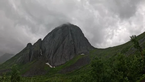 Static wide view of iconic Segla mountain peak shrouded in mist in Senja Norway Stock-Footage 342059369