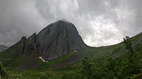 Static wide view of iconic Segla mountain peak shrouded in mist in Senja Norway Stock-Footage 342059376