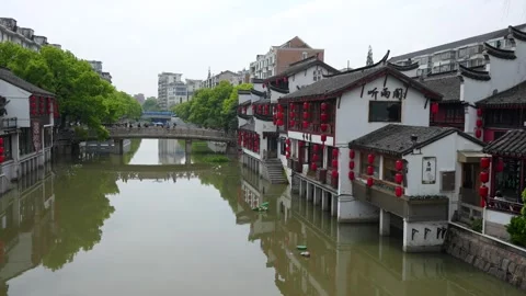 Static wide view of Qibao bridge and lantern hung houses Stock Footage 320081804