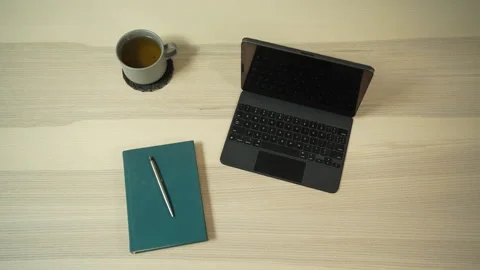 Static workspace with laptop, notebook and coffee cup, top view Video stock 329010357