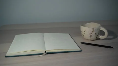 Static workspace with notebook, pen and coffee cup Video stock 327350154