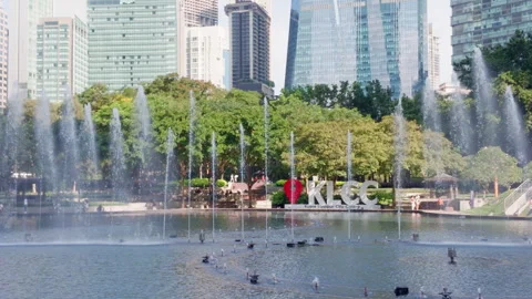 Static Zoomed Shot of KLCC Sign and Lake Symphony Fountains in Kuala Lumpur Stock Footage 343007652
