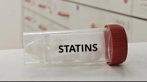 STATINS tablets for lower cholesterol by inhibiting HMG CoA reductase enzyme Stock Photos