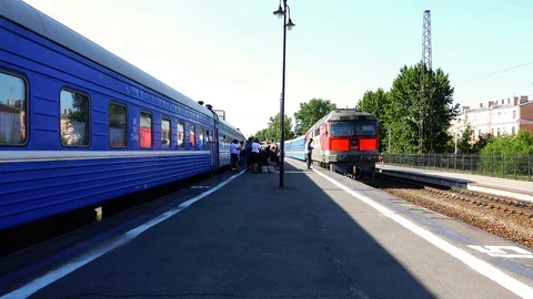 Station platform between two passenger trains Stock Footage 72518571