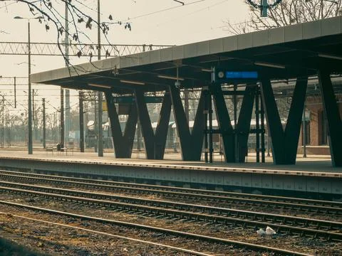 Station platform under muted sky Stock Photos