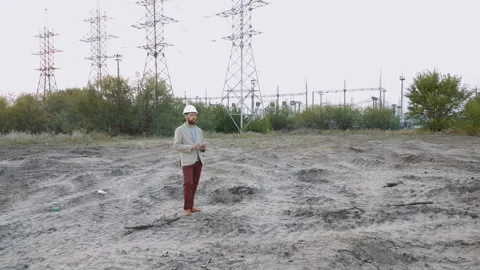 Station technical director with working drawings at nuclear power station Stock Footage 94636476