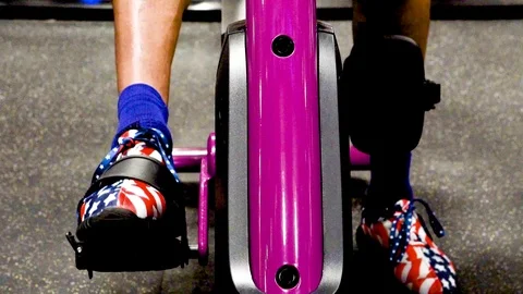Stationary bike forward peddling Stock Footage 125642553