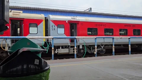 A stationary bin captures the rhythmic rush of an AC 2 Tier LHB train passing by 库存影片 340989759