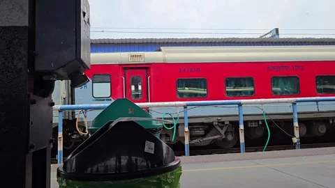 Stationary bin highlights platform cleanliness, capturing the green, waste-segre Stock Footage 340991147