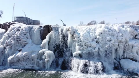 Stationary Drone view of Sioux Falls Park with snow and ice covering the Stock Footage 235962267