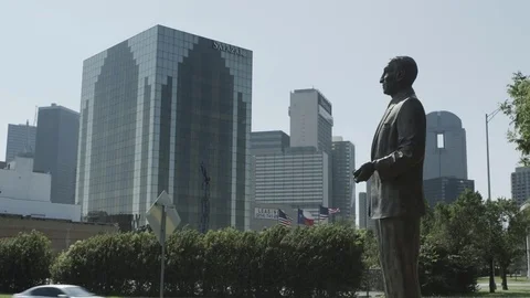 Stationary Shot of the Julius Schepps Statue with Dallas Skyline Background Stock Footage 82284501
