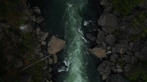 Stationary Top Down View of White Water Rapid. Dramatic Shadows and Color Stock Footage 249820705