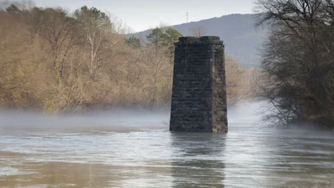 Stationary view of stone pillar in river. Stock Footage 85957795