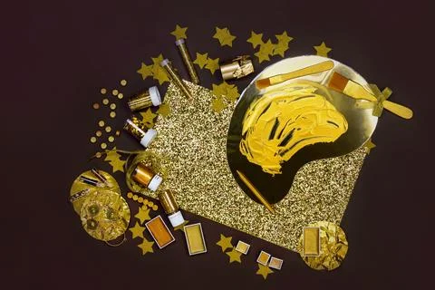 Stationery and objects for creativity and art in golden colors and gold paint 写真素材