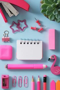 Stationery background with small notepad and pink supplies eraser, sharpener, Stock Photos