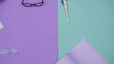 Stationery for creativity and work stop motion on a colored background. Fun Stock Footage 128116476